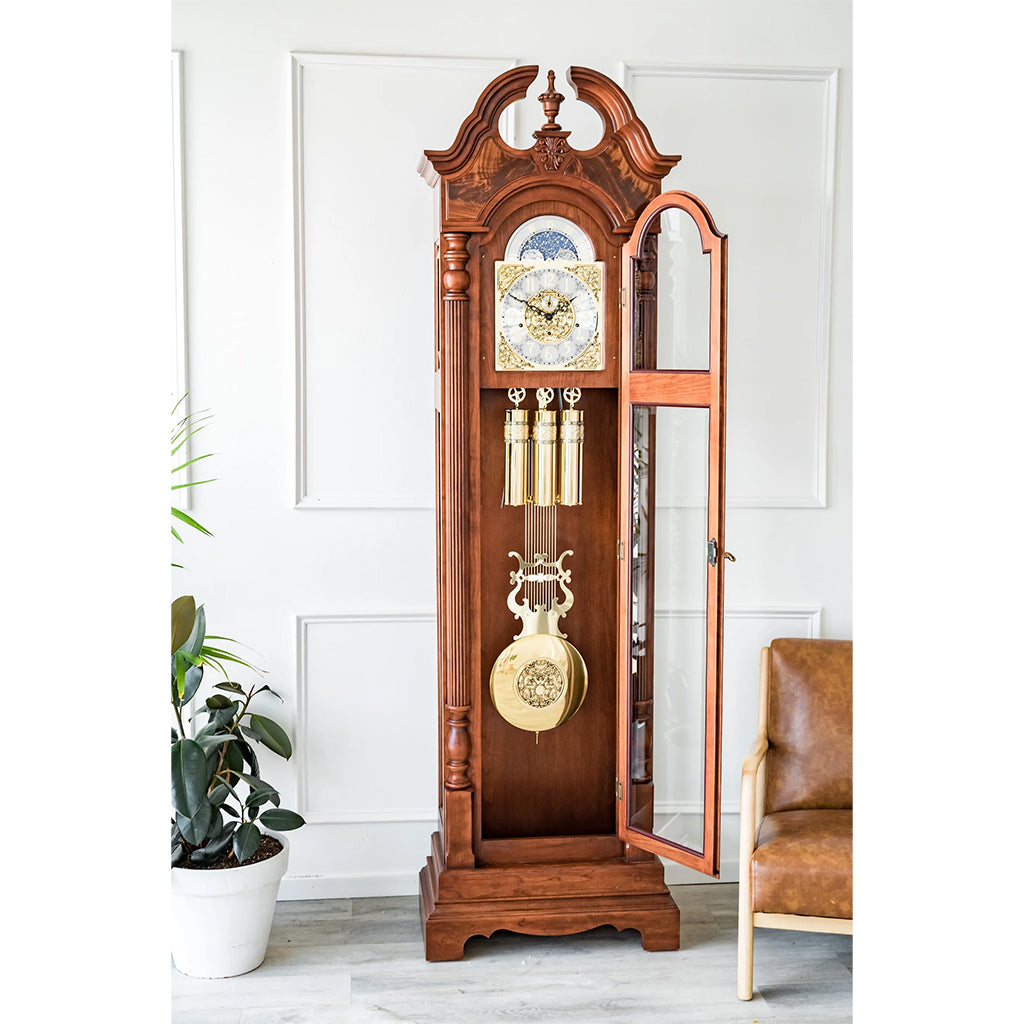 Hermle Blakely Grandfather Clock in Cherry with an open door showing pendulum and weights - Premier Clocks