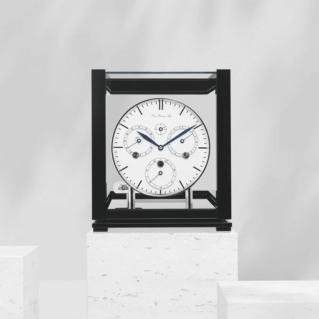 Hermle Perpetual Calendar Mantel Clock in Black with White Dial in interior decor - Premier Clocks