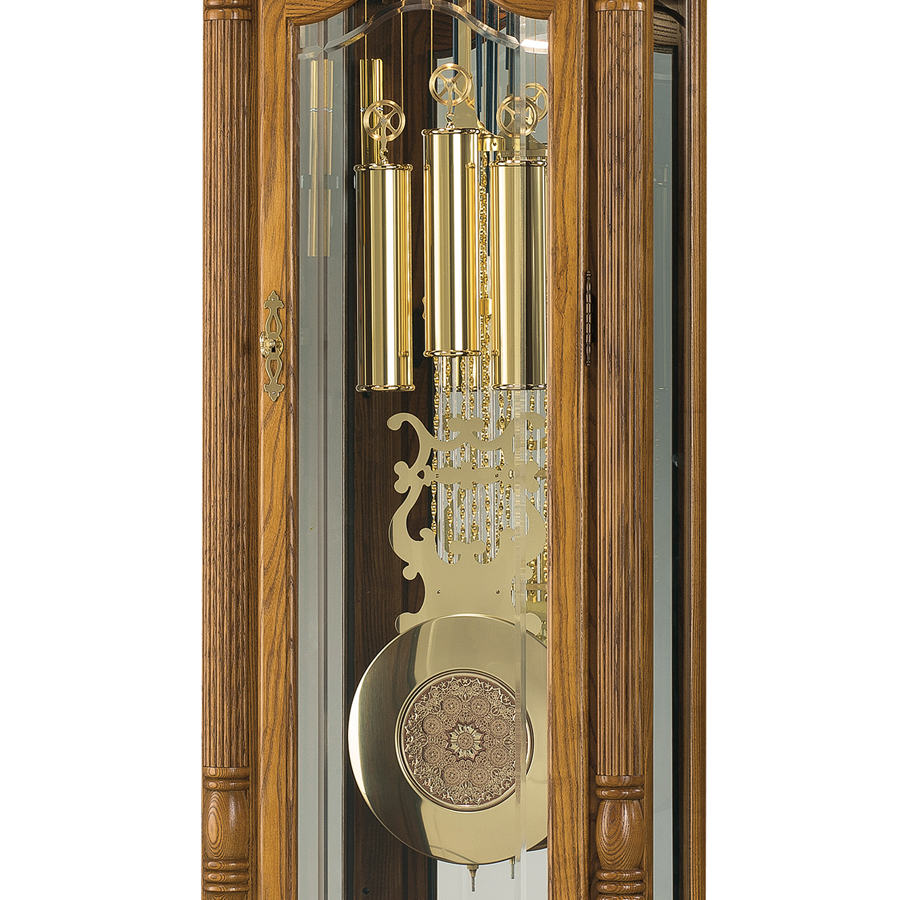 Howard Miller Browman Grandfather Clock 611202 cable-driven weights and pendulum with a decorated center - Premier Clocks