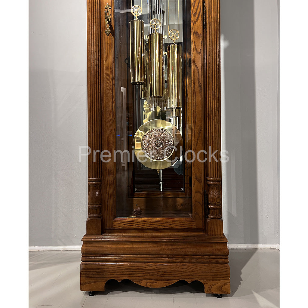 Howard Miller Gavin Grandfather Clock 610985 real photo of the base, pendulum, and weights - Premier Clocks