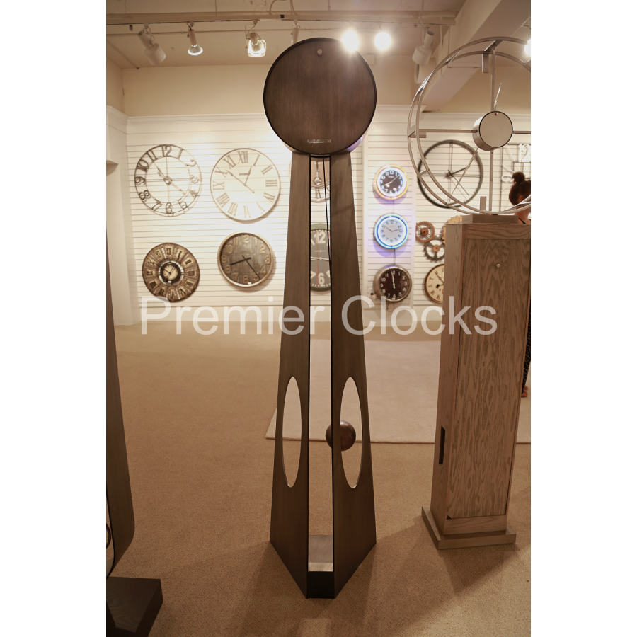 Howard Miller Odie Floor Clock 615114 real photo back in interior of a showroom - Premier Clocks