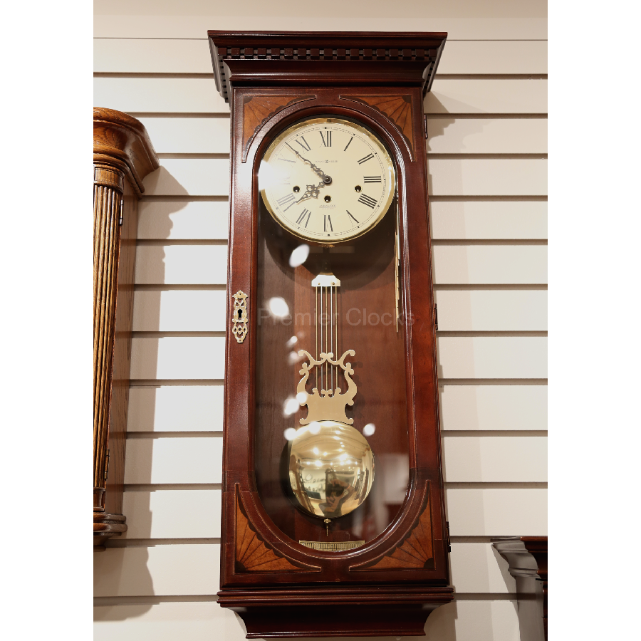 Howard Miller Lewis Wall Clock 613637 real image front view showing details and carvings - Premier Clocks